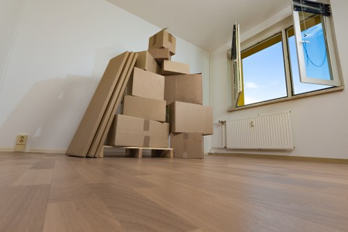 Boxes and furniture arranged for unloading at a new Harrow property