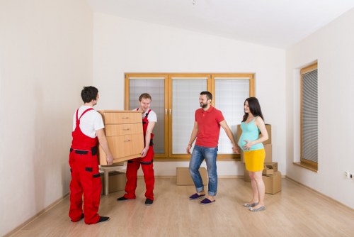 Careful loading of household items for removals in Harrow