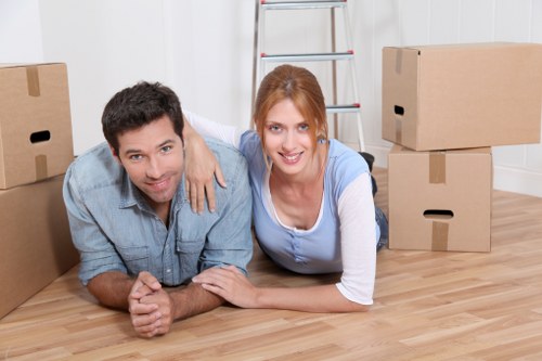 Loading furniture and boxes into a moving van in Harrow