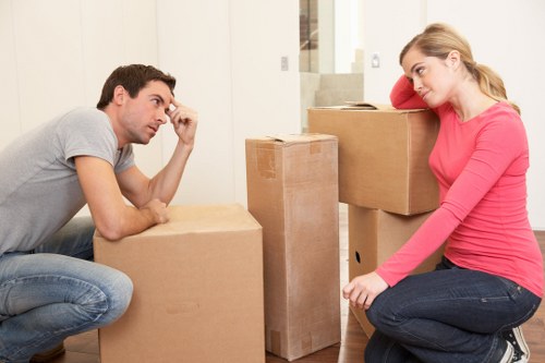 Local moving team transporting boxes and furniture in Harrow